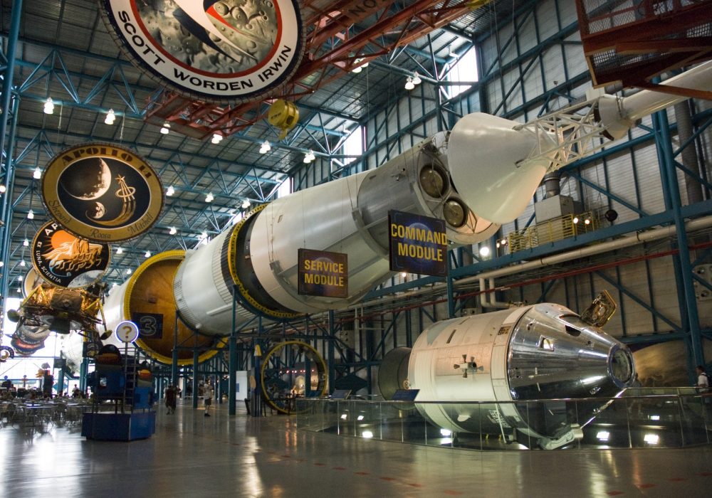 Saturn V rocket displayed above Apollo command and service modules at the Apollo/Saturn V Center at the Kennedy Space Center.